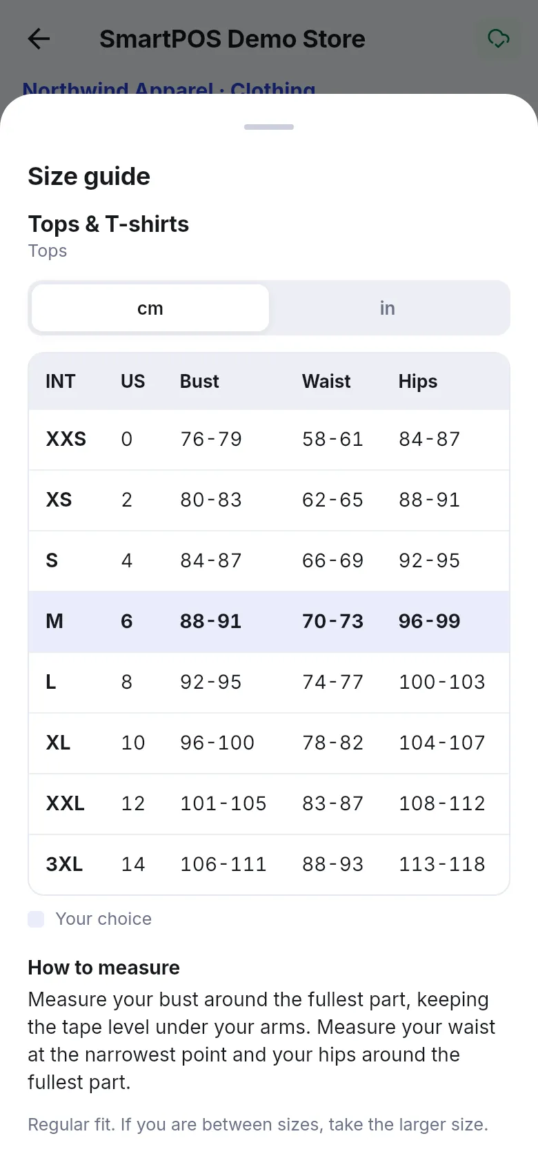 Size guide sheet in the SmartPOS Shopper app with cm and in tabs, INT, US, Bust, Waist and Hips columns, the chosen size M highlighted, How to measure and a fit note